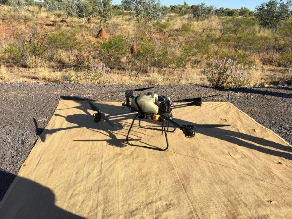 A drone equipped with a magnetometer used in surveys to identify magnetite deposits. Magnetite, a common iron ore and the world's most magnetic naturally occurring mineral, is often found near gold deposits. (Emmerson Resources)
