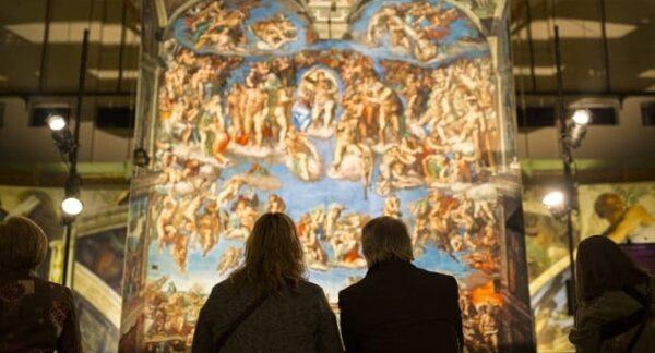 Attendees of the “Michelangelo’s Sistine Chapel: The Exhibition" in Los Angeles view the “Last Judgment.” (SistineChapel)