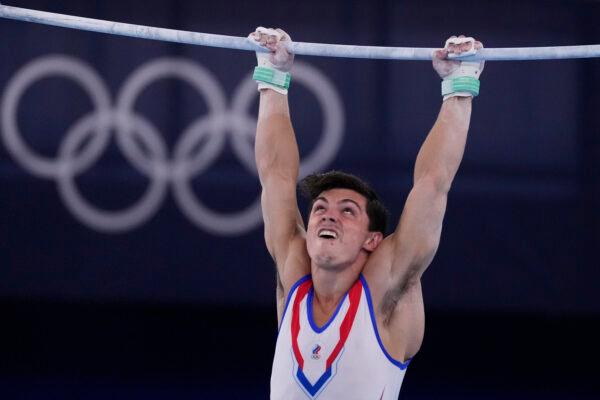 Artur Dalaloyan, of the Russian Olympic Committee, performs on the horizontal bar during the artistic men's team final at the 2020 Summer Olympics in Tokyo, Japan, on July 26, 2021. (Ashley Landis/AP Photo)