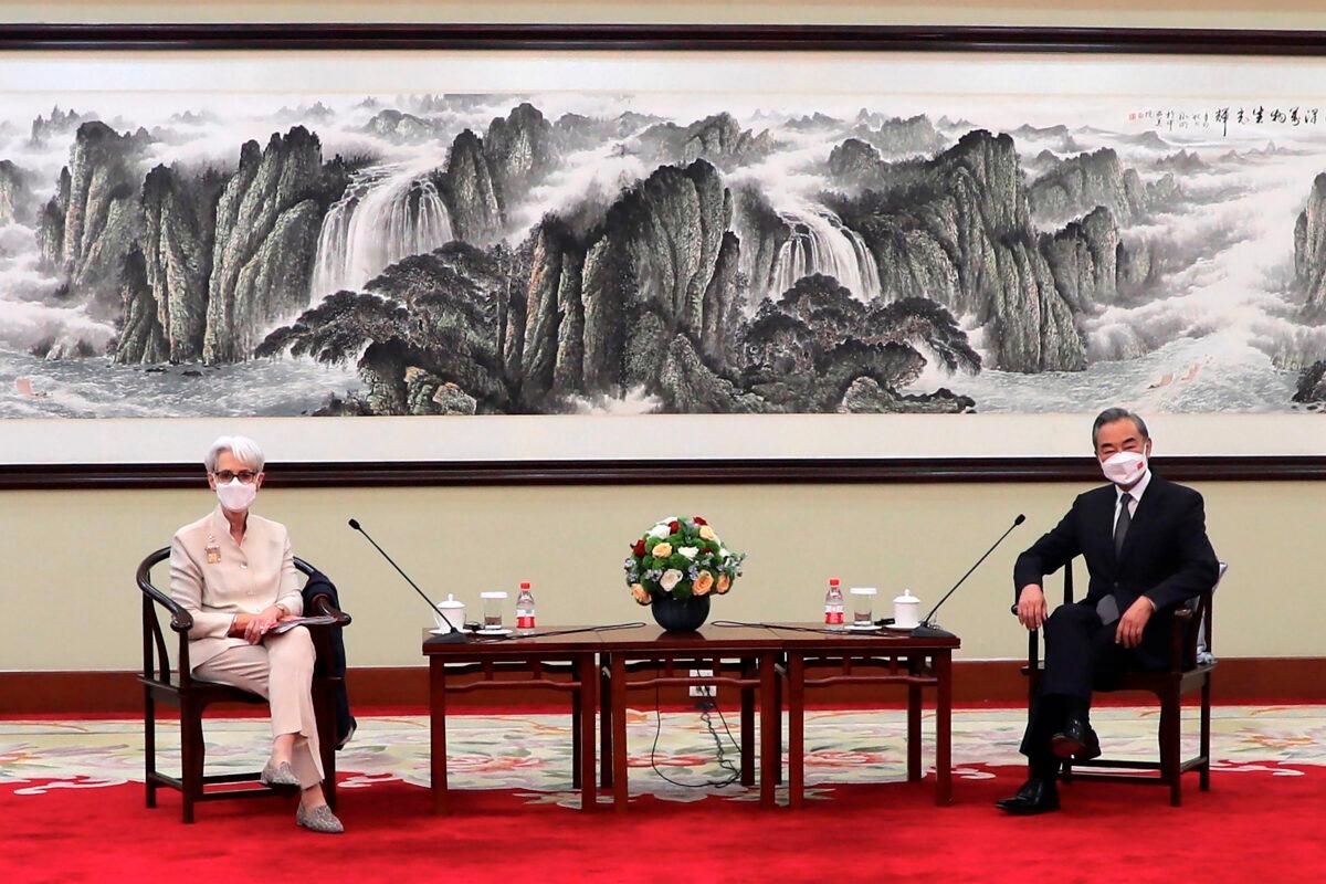 United States Deputy Secretary of State Wendy Sherman (L) and Chinese foreign minister Wang Yi sit together in Tianjin, China, on July 26, 2021. (Mark Schiefelbein/AP Photo)