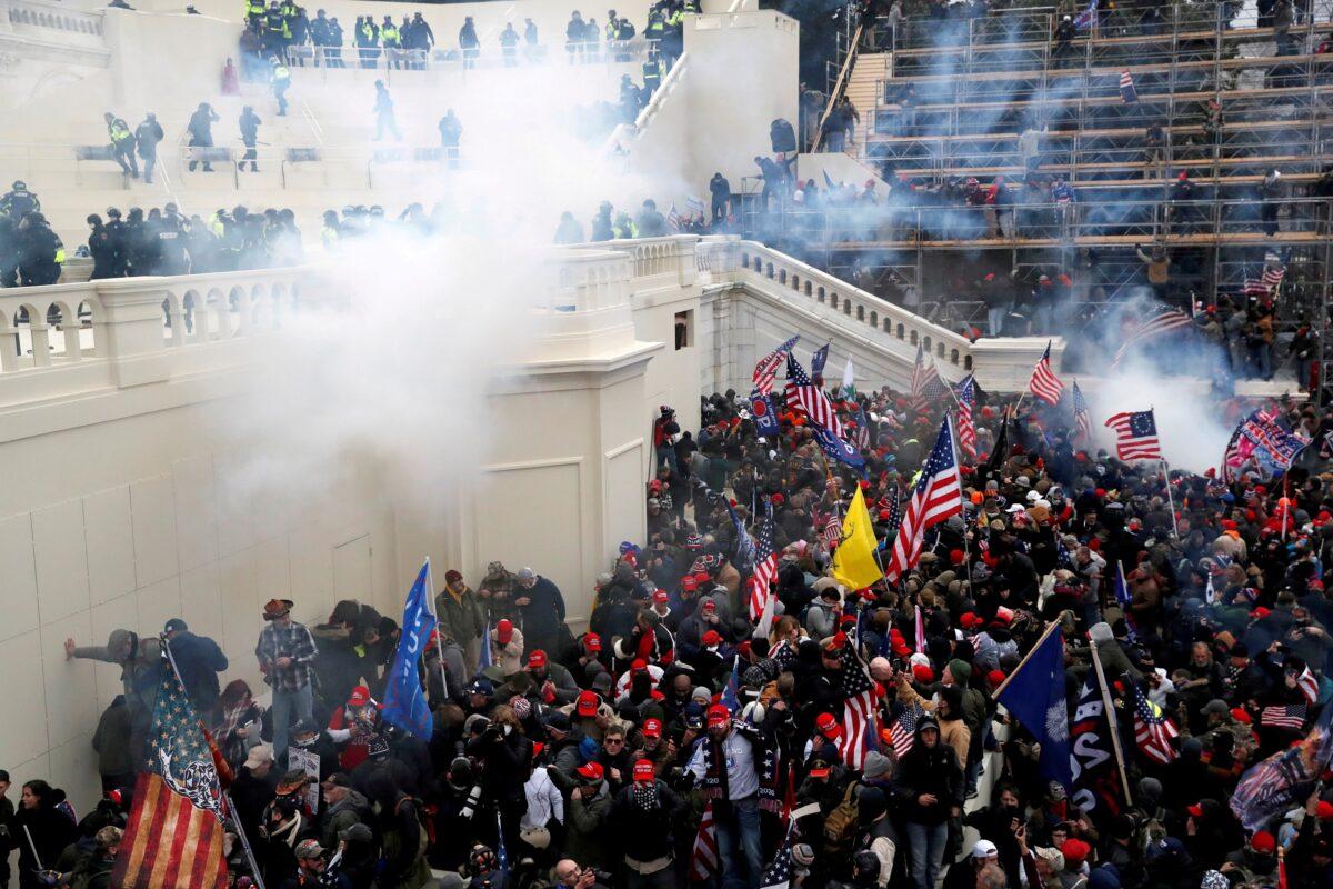 Police release tear gas into a crowd during clashes at the U.S. Capitol Building in Washington on Jan. 6, 2021. (Shannon Stapleton/Reuters)