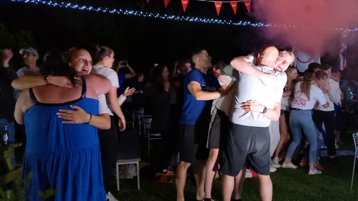 Screengrab taken from handout video issued by Speedo of the family and friends of British swimmer Tom Dean celebrating after watching him winning Olympic gold in the final of the men's 200 metres freestyle in Maidenhead, Britain, on July 27, 2021. (Tikki Patel/Speedo/PA Media)
