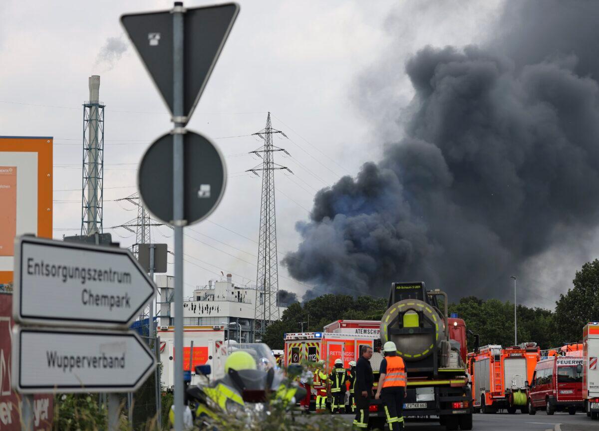 A dark cloud of smoke rises above the Chempark in Leverkusen, Germany, on July 27, 2021. (Oliver Berg/dpa via AP)