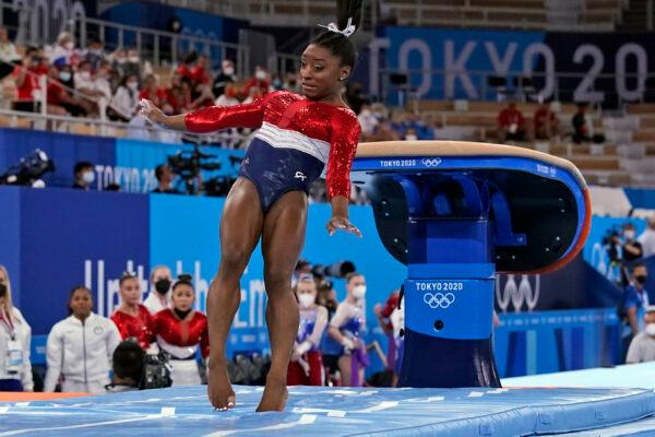 Simone Biles, of the United States, lands from the vault during the artistic gymnastics women's final at the 2020 Summer Olympics, in Tokyo on July 27, 2021. (Gregory Bull/AP Photo)