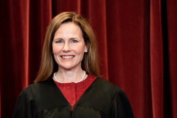 Associate Justice Amy Coney Barrett stands during a group photo of the justices at the Supreme Court in Washington, on April 23, 2021. (Erin Schaff-Pool/Getty Images)