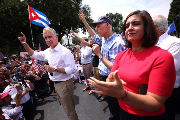 (L–R) Rep. Mario Díaz-Balart (R-Fla.), Sen. Rick Scott (R-Fla.), and Rep. Nicole Malliotakis (R-N.Y.) speak at a Cuban freedom rally near the White House on July 26, 2021. (Kevin Dietsch/Getty Images)