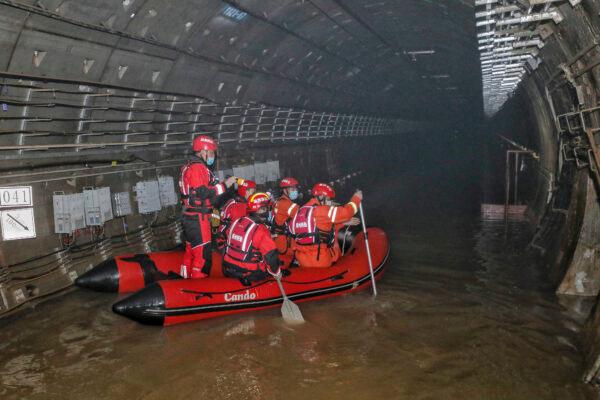 Rescuers from Jiangsu Province are searching inside metro line 5, which was flooded in Zhengzhou, central China's Henan Province on July 26, 2021. (STR/AFP via Getty Images)