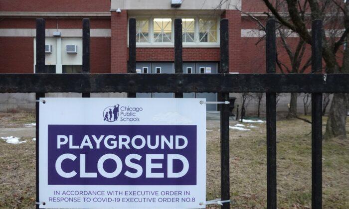 A sign outside Columbus Elementary School in Chicago lets visitors know that the playground is closed on Jan. 25, 2021. (Scott Olson/Getty Images)