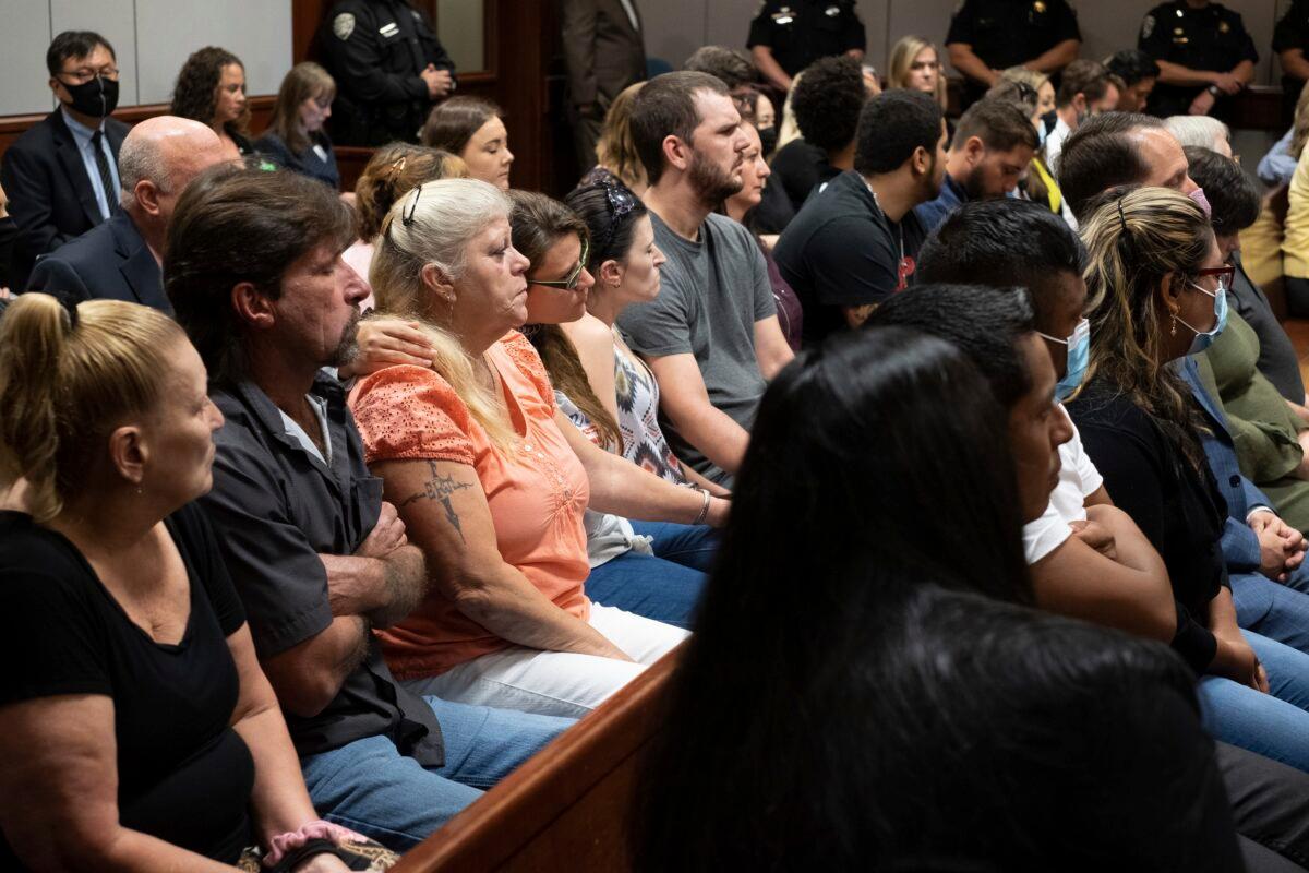 Friends and families of the victims listen during the plea hearing for spa shooting suspect Robert Aaron Long in the Superior Court of Cherokee County in Canton, Ga., on July 27, 2021. (Ben Gray/Pool/Atlanta Journal-Constitution via AP)