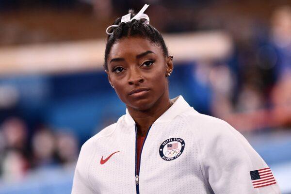Simone Biles of the United States waits for the final results of the artistic gymnastics women's team final during the Tokyo 2020 Olympic Games at the Ariake Gymnastics Centre in Tokyo, Japan, on July 27, 2021. (Loic Venance/AFP via Getty Images)