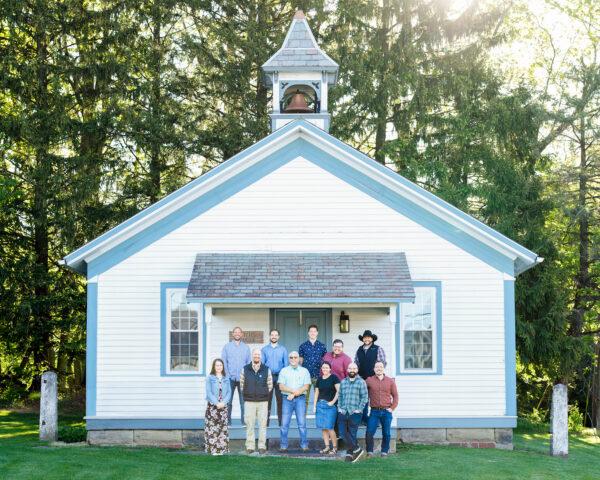 The Plain Values magazine staff in front of an old schoolhouse in Winesburg, Ohio. (Landon Troyer/Plain Values)