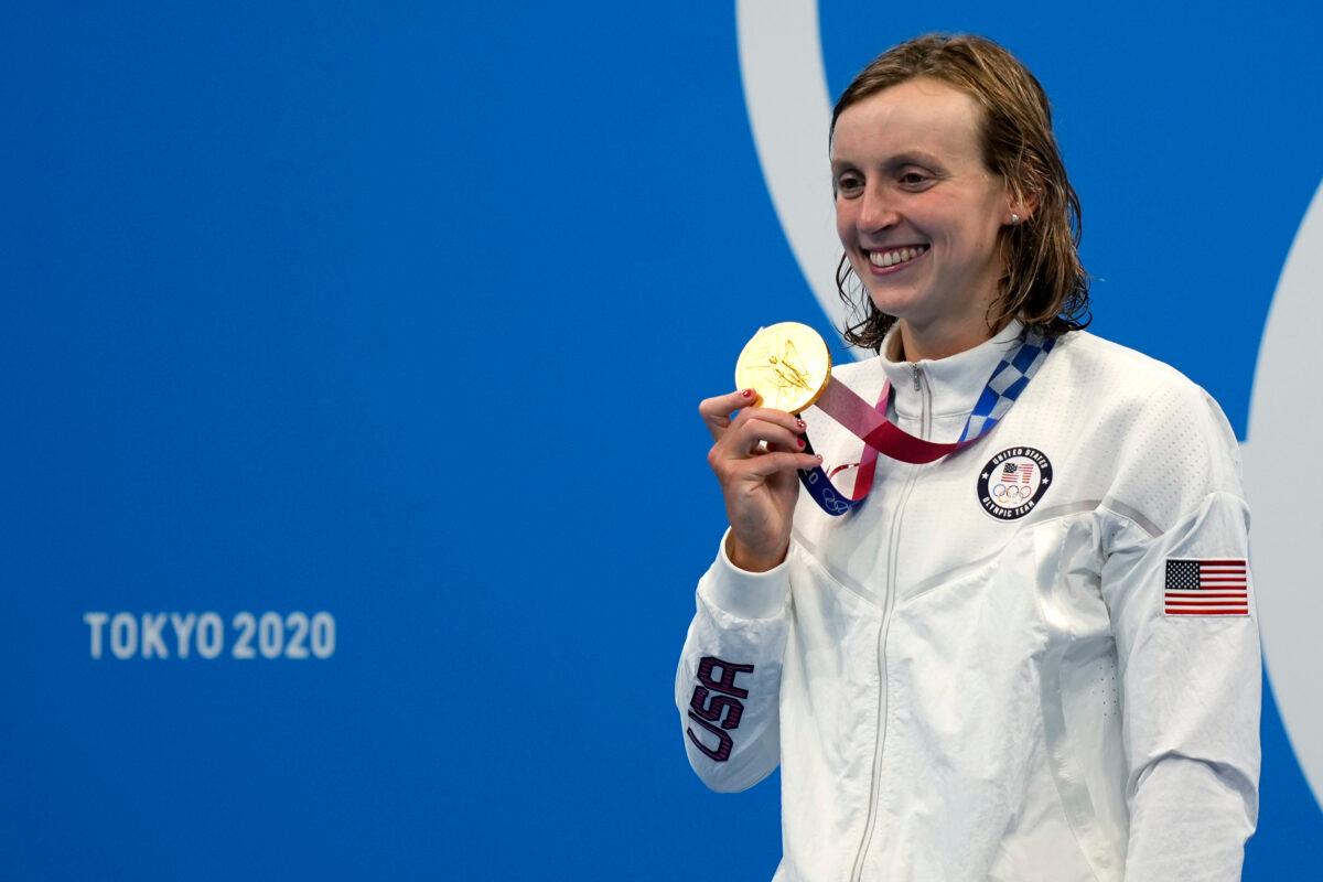 Katie Ledecky, of the United States, holds her gold medal after winning the women's 1500-meter freestyle final at the 2020 Summer Olympics in Tokyo, Japan on July 28, 2021. (Martin Meissner/AP Photo)