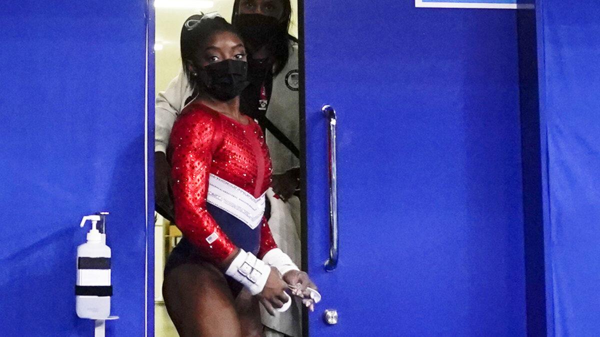 Simone Biles, of the United States, leaves a medical station during the artistic gymnastics women's final at the 2020 Summer Olympics in Tokyo, on July 27, 2021. (Gregory Bull/AP Photo)