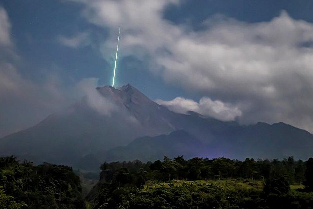 Photographer Captures the Moment a Meteor Appears to Shoot Into Mouth of Volcano in Indonesia