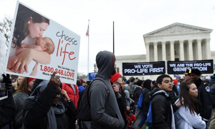 228 Federal Lawmakers Urge Supreme Court to Reverse Roe v. Wade