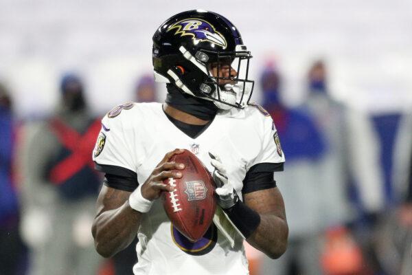 Lamar Jackson #8 of the Baltimore Ravens looks to pass in the first quarter against the Buffalo Bills during the AFC Divisional Playoff game at Bills Stadium in Orchard Park, N.Y., on Jan. 16, 2021. (Bryan M. Bennett/Getty Images)