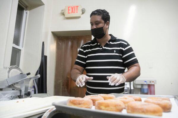 Richard Hernández works inside his bakery, Sabor Rico Bakery, in North Philadelphia. Hernández bought the bakery three months before the pandemic started. (Heather Khalifa/The Philadelphia Inquirer/TNS)