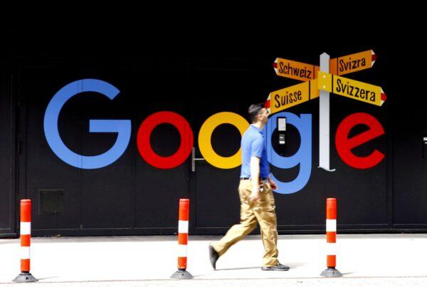 A man walks past a logo of Alphabet's Google in front of an office building in Zurich on July 1, 2020. (Arnd Wiegmann/Reuters)