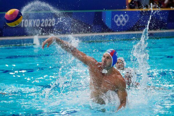 Italy's Pietro Figlioli (4) shoots during a preliminary round men's water polo match against the United States at the 2020 Summer Olympics, in Tokyo, Japan, on July 29, 2021. (Mark Humphrey/AP Photo)