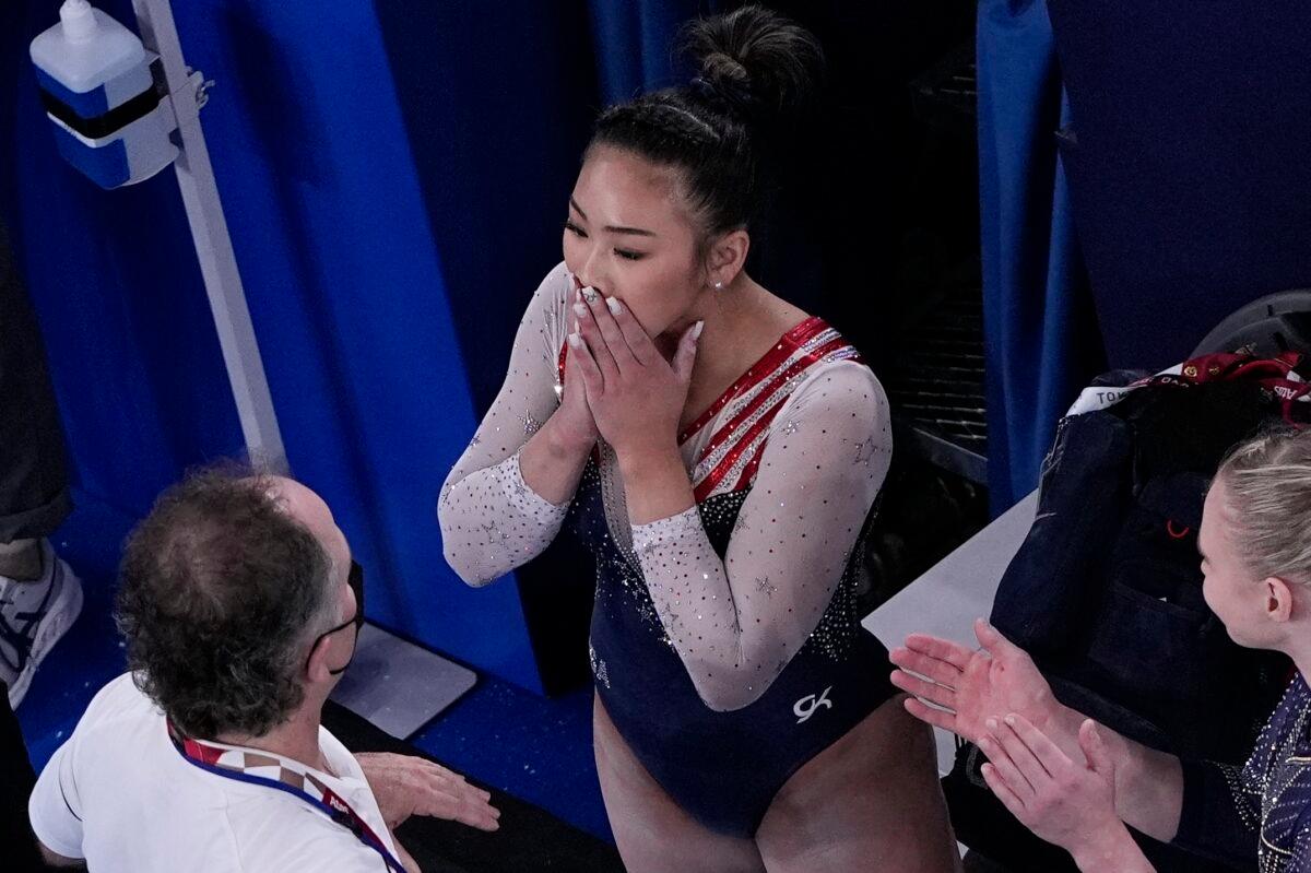 Sunisa Lee of the United States reacts after getting her score on the floor performs during the artistic gymnastics women's all-around final at the 2020 Summer Olympics in Tokyo, Japan, on July 29, 2021. (Morry Gash/AP Photo)