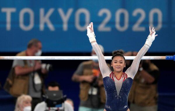 Sunisa Lee of the United States finishes on the uneven bars during the artistic gymnastics women's all-around final at the 2020 Summer Olympics in Tokyo, Japan, on July 29, 2021. (Ashley Landis/AP Photo)