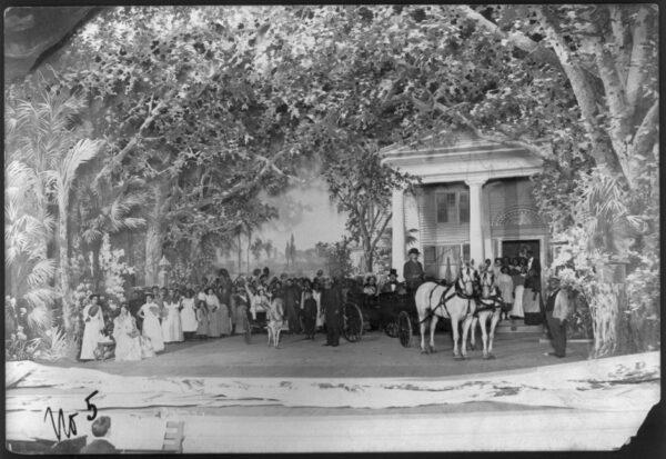 There were so many stage productions of "Uncle Tom's Cabin" touring the country that each boasted a bigger cast and more more spectacular scenes. A crowd scene in front of a plantation house from a circa 1901 production. Library of Congress. (Public Domain)