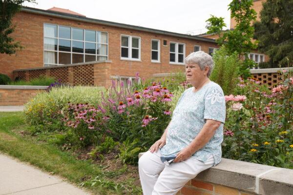 Sister Mary Carton relaxes in the garden outside Our Lady of the Angels Convent in Wheaton, Ill., on July 28, 2021. (Jackson Elliott/The Epoch Times)