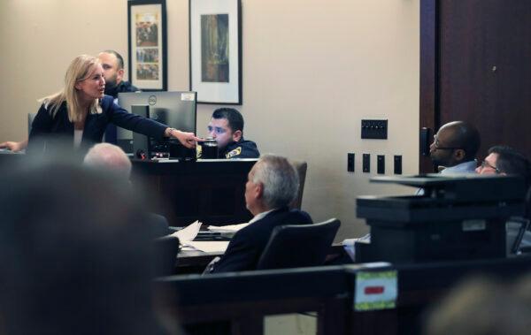 Prosecutor Tamara Strauch points to defendant Otis McKane during closing statements on day 11 of the McKane's capital murder trial for the 2016 shooting of SAPD detective Benjamin Marconi, in San Antonio, Texas, on July 26, 2021. (Kin Man Hui/The San Antonio Express-News via AP)