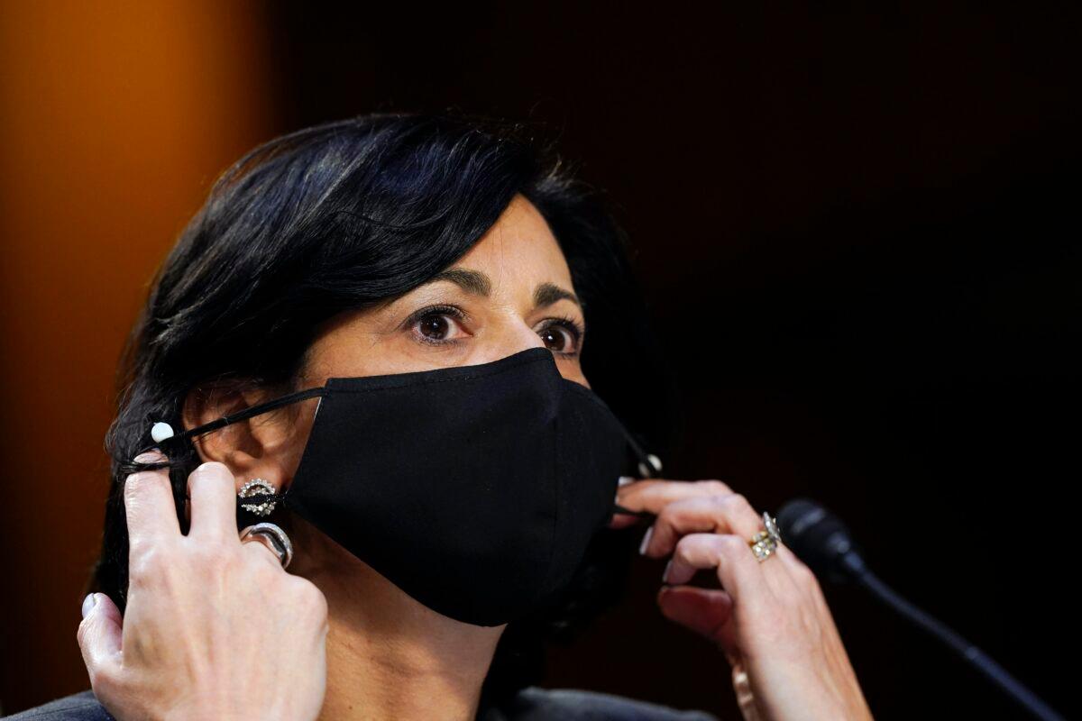 Dr. Rochelle Walensky, director of the Centers for Disease Control and Prevention, adjusts her face mask during a Senate hearing in Washington on March 18, 2021. (Susan Walsh/AP Photo)