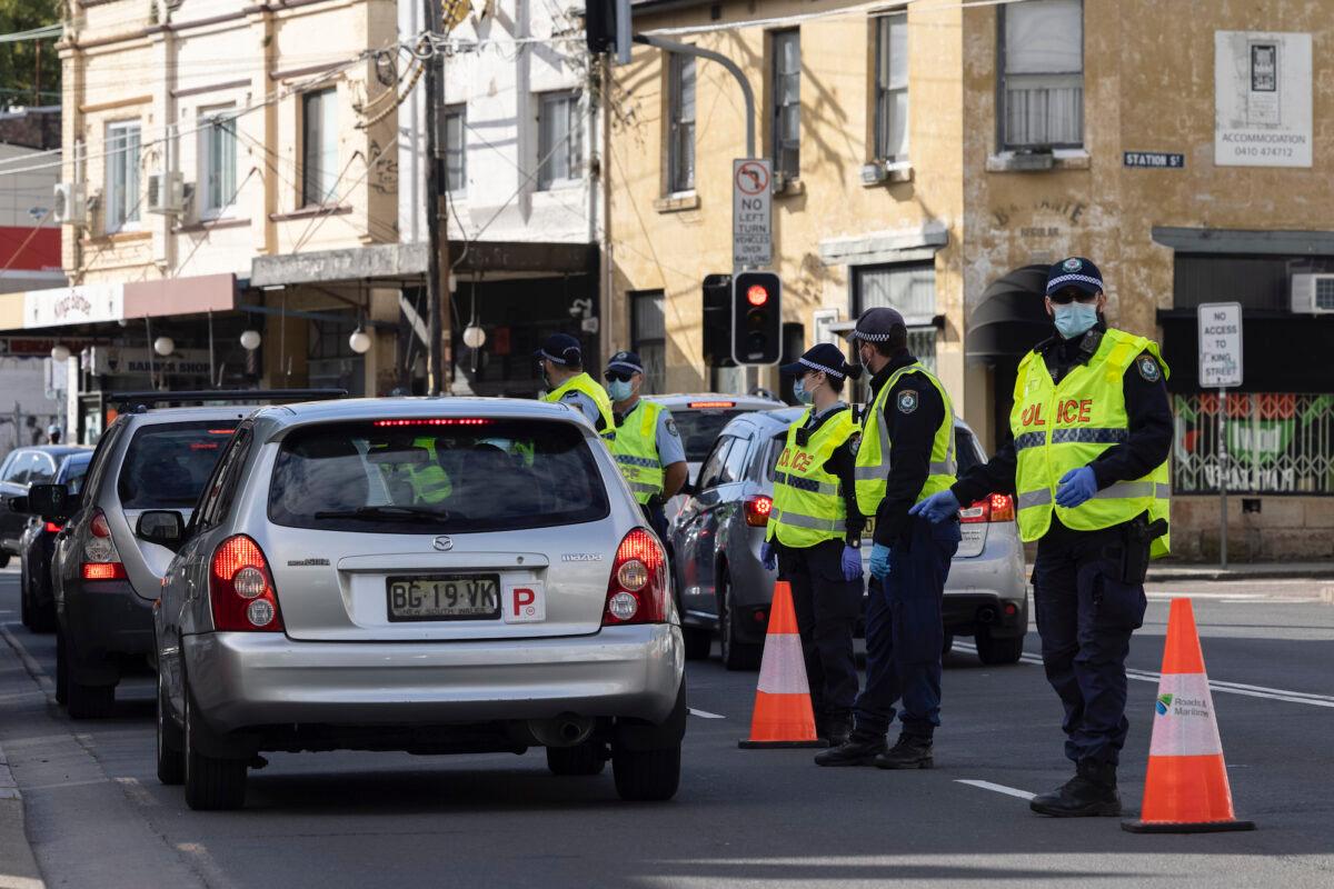NSW Police check drivers on Enmore Road as part of the enforcement of Public Health orders in Sydney, on July 31, 2021. (Brook Mitchell/Getty Images)