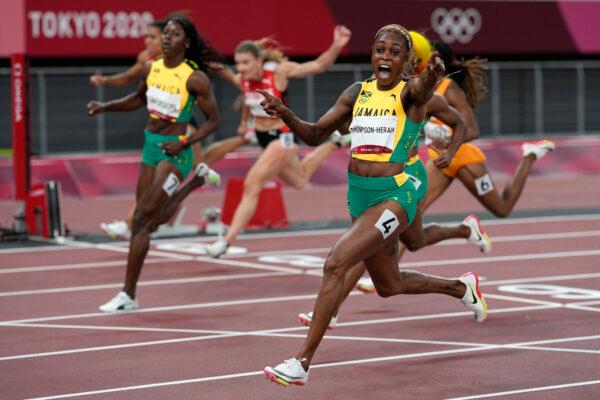 Elaine Thompson-Herah of Jamaica, celebrates as she wins the women's 100-meters final at the 2020 Summer Olympics, in Tokyo, on July 31, 2021. (David J. Phillip/AP Photo)