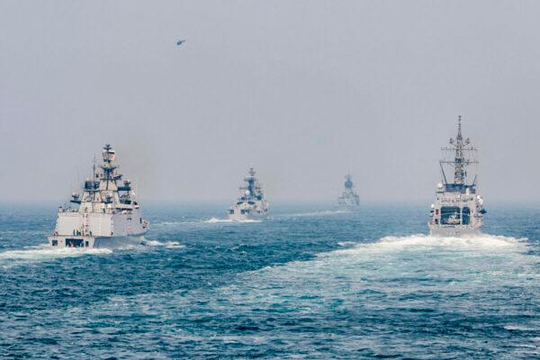 The Arleigh Burke-class guided-missile destroyer USS John S. McCain (DDG 56) sails in formation with ships from the Indian Navy, Royal Australian Navy, and Japan Maritime Self-Defense Force while conducting replenishment-at-seas approaches (RASAPs) as part of Malabar 2020. (U.S. INDOPACOM)