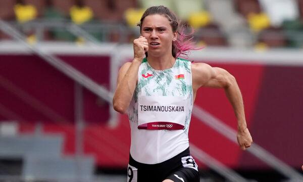Krystsina Tsimanouskaya of Belarus runs in the women's 100-meter run at the 2020 Summer Olympics in Tokyo, Japan, on July 30, 2021. (Martin Meissner/AP Photo)
