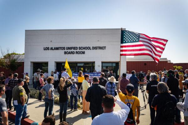 Demonstrators gather in front of Los Alamitos Unified School District Headquarters in Los Alamitos, Calif., on May 11, 2021. (John Fredricks/The Epoch Times)