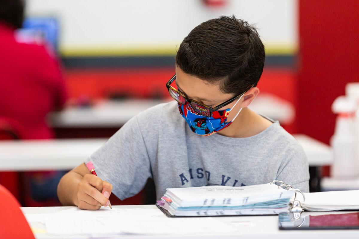 In this file photo, a student works on a math assignment in Laguna Niguel, Calif., on May 12, 2021. (John Fredricks/The Epoch Times)