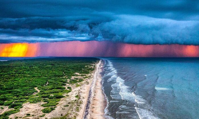 Photographer Snaps Stormy Sublime Sunset—Over Land and Sea—at Carova Beach, NC