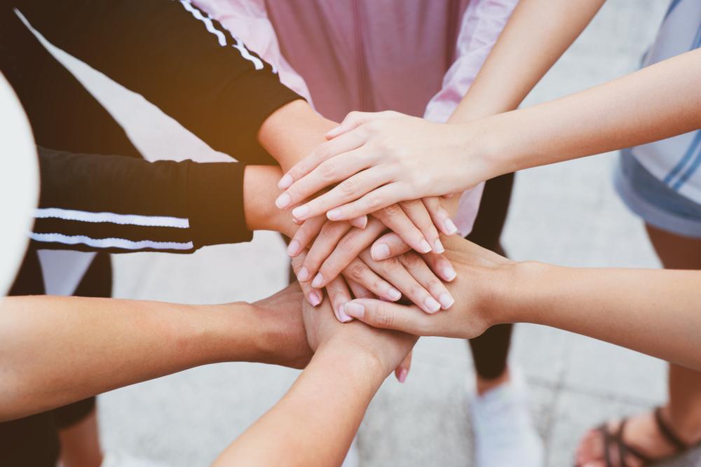 Community is key. If you can, join an online support group or find someone else who’s also trying to become debt-free. (Rapeepat Pornsipak/Shutterstock)