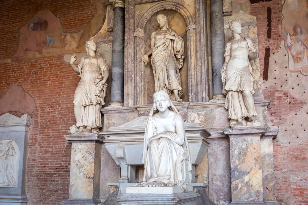 The sculptures give prominence to a tomb in the cemetery, and remnants of frescoes appear on the walls. (Patryk Kosmider/Shutterstock)