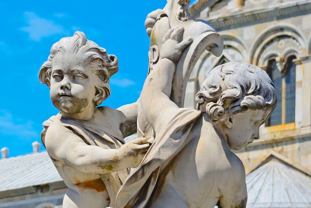 Putti (cherubs) adorn a fountain that stands in front of the cathedral and greet guests upon their arrival at the main point in the square.(Gabriele Maltinti/Shutterstock)