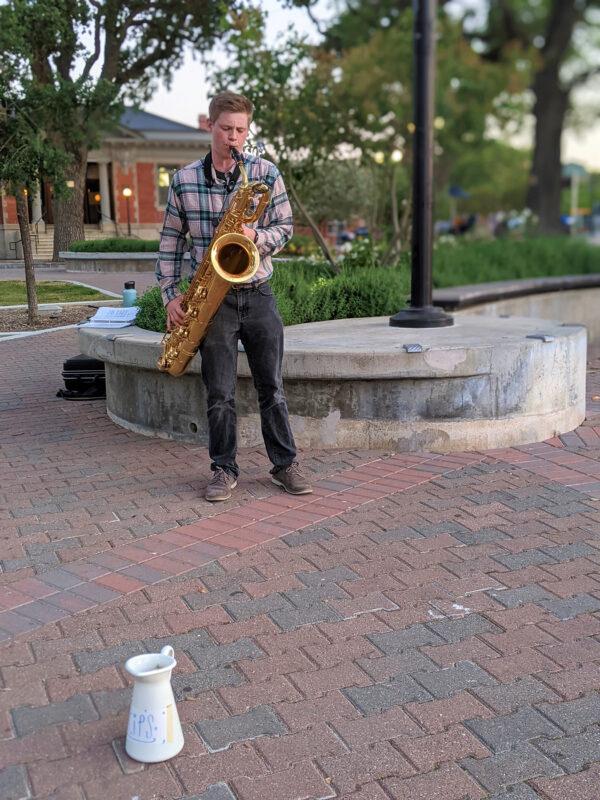 Saxophonist Tyler Anderson treats passersby to soothing jazz tunes at City Park in the center of downtown Paso Robles, Calif. (Courtesy of Athena Lucero)
