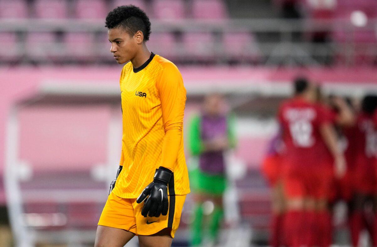 United States' goalkeeper Adrianna Franch reacts after Canada's Jessie Fleming scored the opening goal from the penalty spot during a women's semifinal soccer match at the 2020 Summer Olympics, in Kashima, Japan, on Aug. 2, 2021. (Andre Penner/AP)
