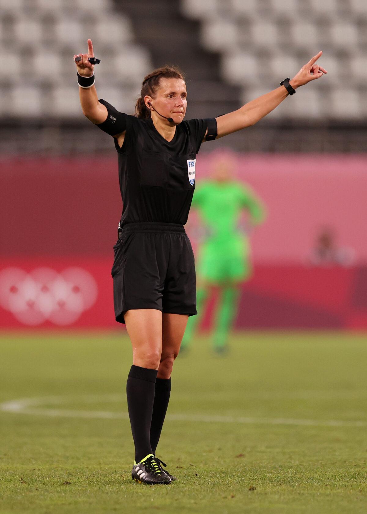 Match referee Kateryna Monzul signals for a video review check for a potential penalty for Team Canada during the women's soccer semifinal match between the USA and Canada on day 10 of the Tokyo Olympic Games at Kashima Stadium in Kashima, Ibaraki, on Aug. 2, 2021. (Naomi Baker/Getty Images)