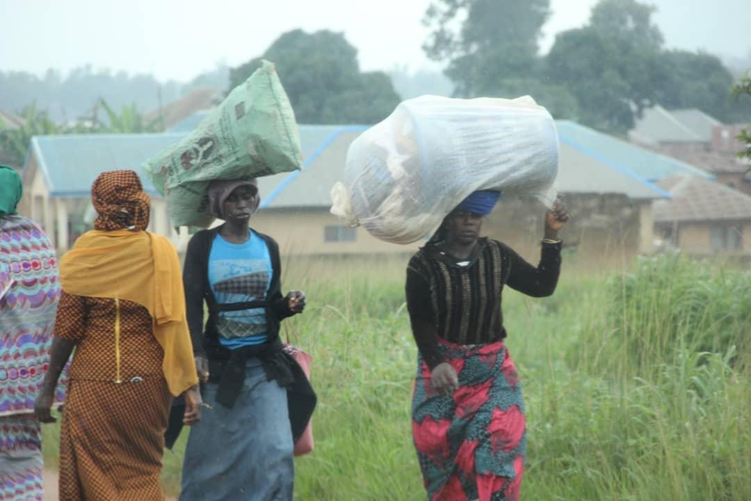 Displaced people walking out of Jebbu Miango, Plateau State, Nigeria, on the morning of Aug. 1, 2021. (Masara Kim/The Epoch Times)