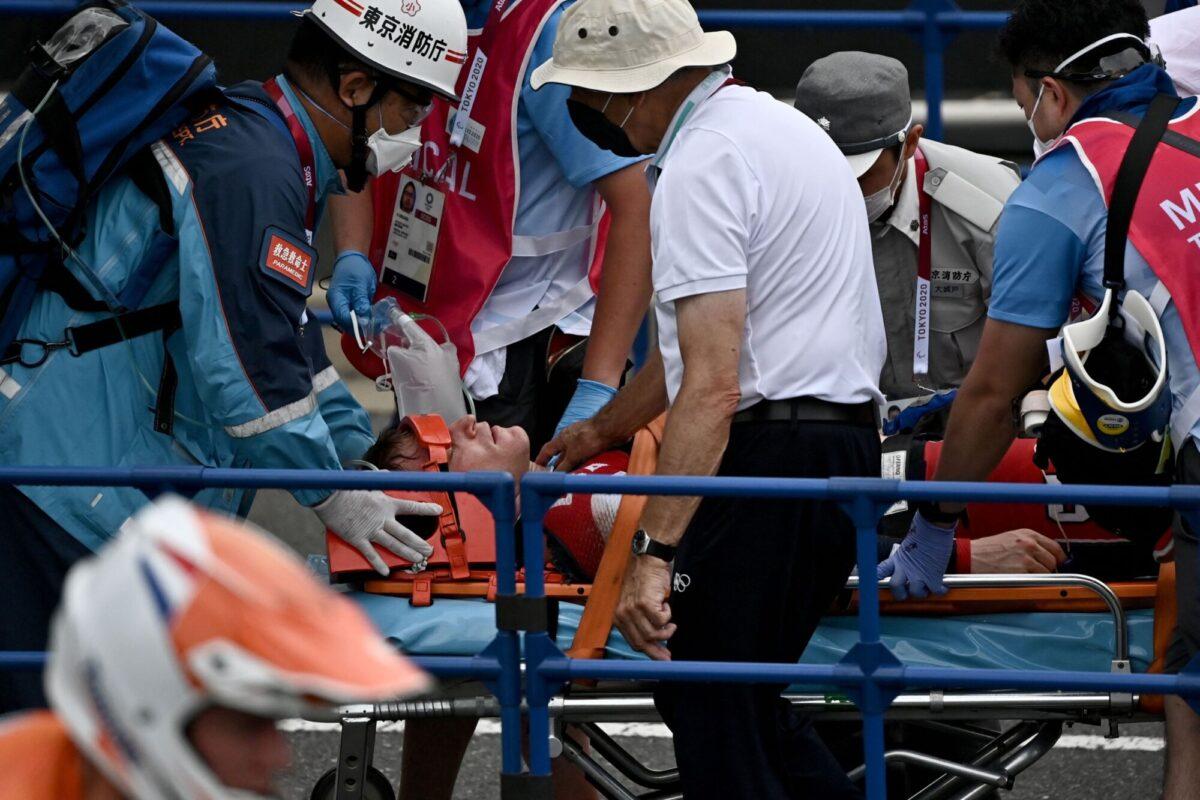 USA's Connor Fields receives medical assistance after the cycling BMX racing men's semi-finals run at the Ariake Urban Sports Park during the Tokyo 2020 Olympic Games in Tokyo, Japan, on July 30, 2021. (Jeff Pachoud/AFP via Getty Images)
