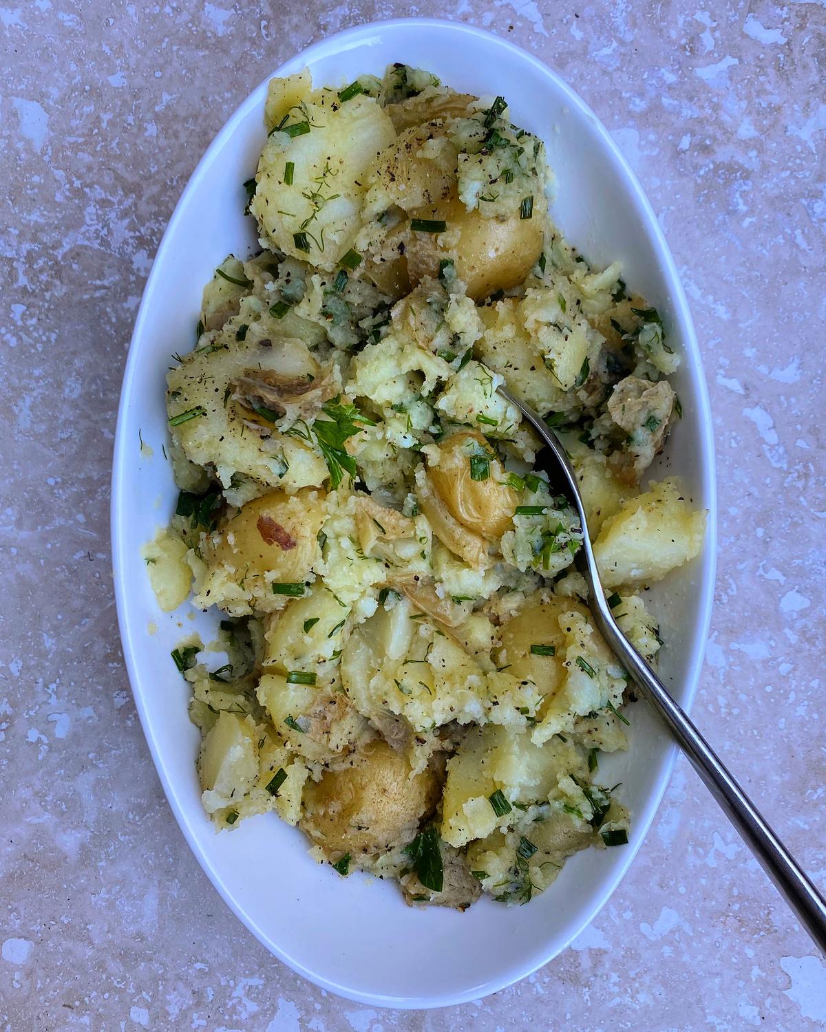 This European-style potato salad is light and bright, laced with vinegar and oil and tumbled with handfuls of fresh herbs. (Lynda Balslev for Tastefood)