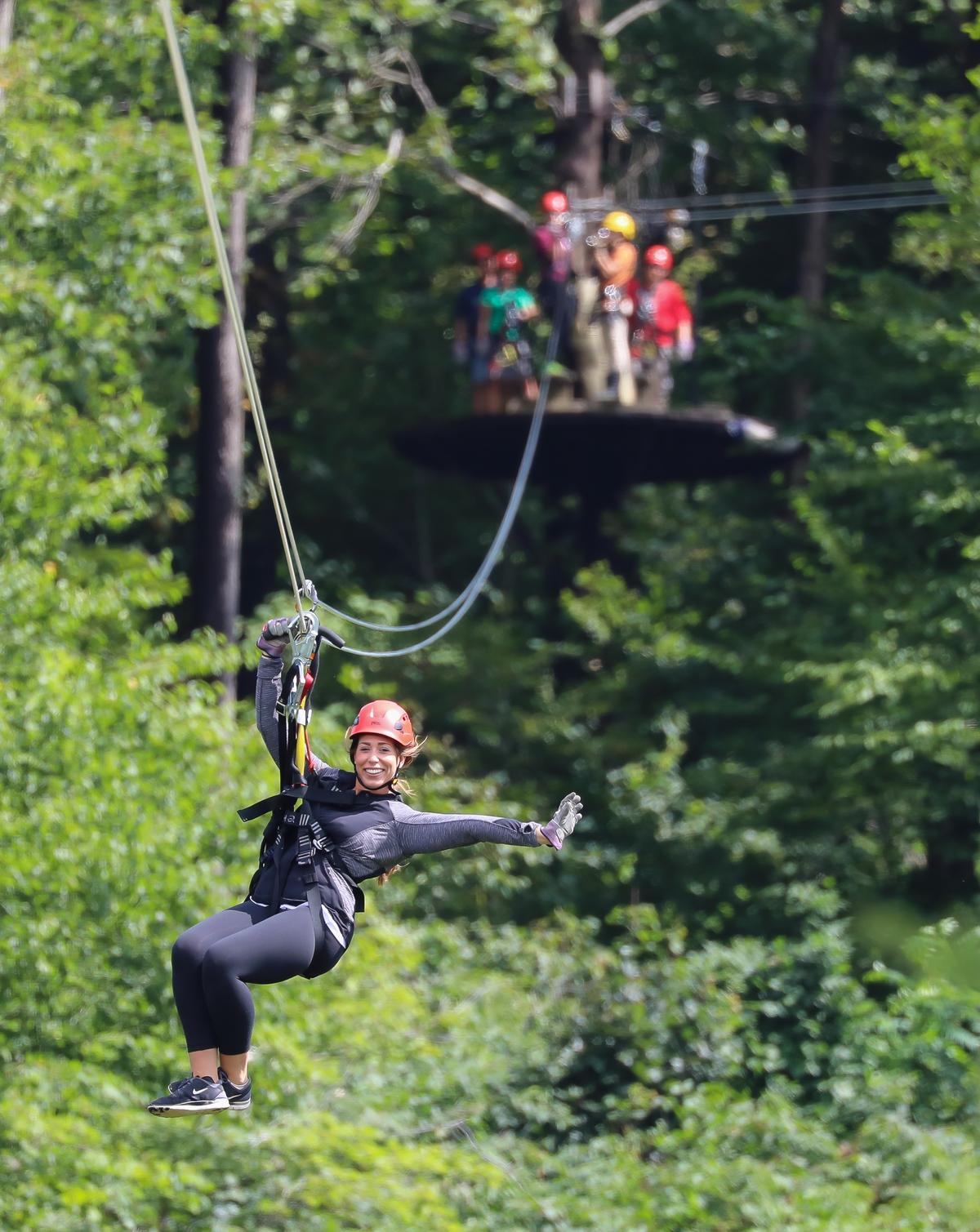A guest enjoys the Screaming Hawk Zipline at Seven Springs Mountain Resort. (Courtesy of Seven Springs)