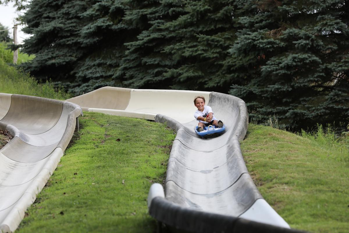 A child comes around a banked turn on the Alpine Slide at Seven Springs Mountain Resort. (Courtesy of Seven Springs)