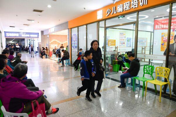 Parents and guardians waiting outside a children's computer coding training center in Beijing. (Wang Zhao/AFP via Getty Images)
