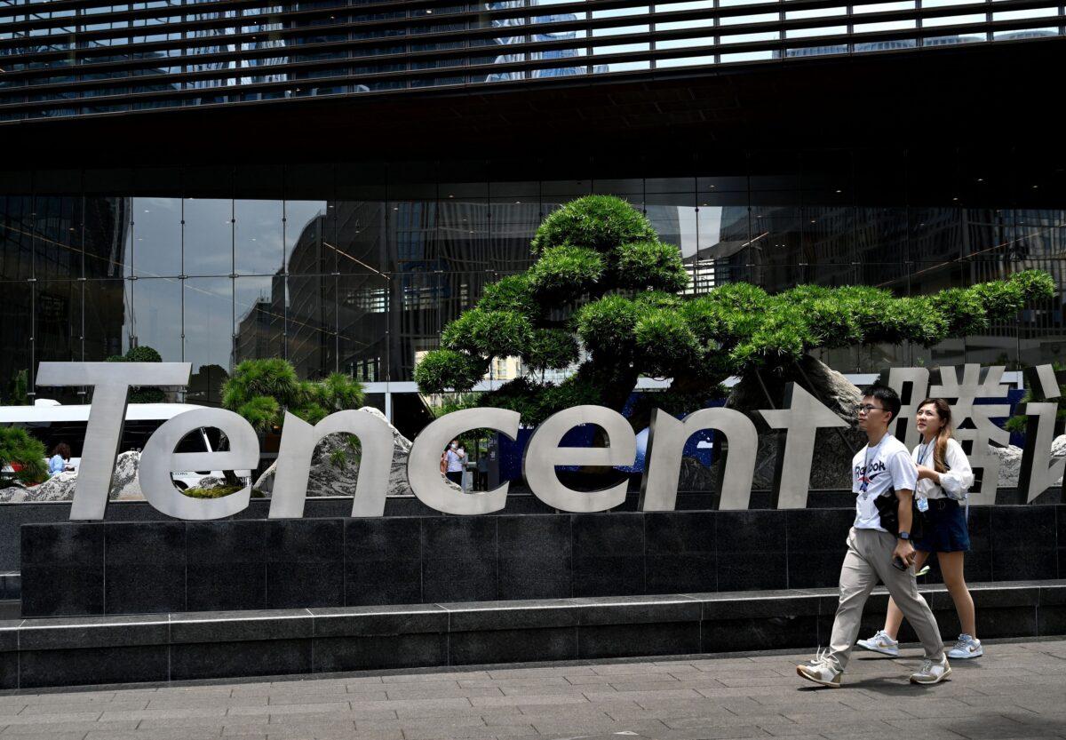 People walk past the Tencent headquarters in Shenzhen, southern China's Guangdong Province, on May 26, 2021. (Noel Celis/AFP via Getty Images)