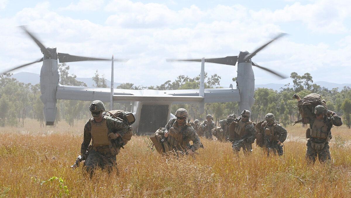 U.S. Marines disembark from a V-22 Osprey during a troop insertion as part of Exercise 'Talisman Sabre 21' in Townsville, Australia, on July 27, 2021. (Ian Hitchcock/Getty Images)